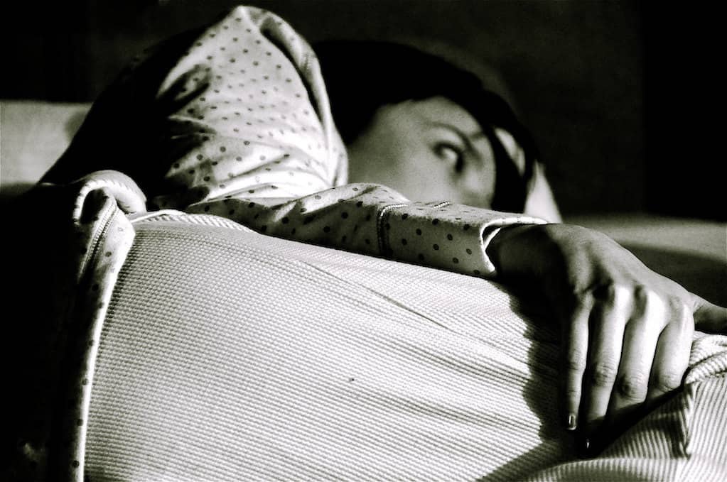 photo of a woman trying to sleep