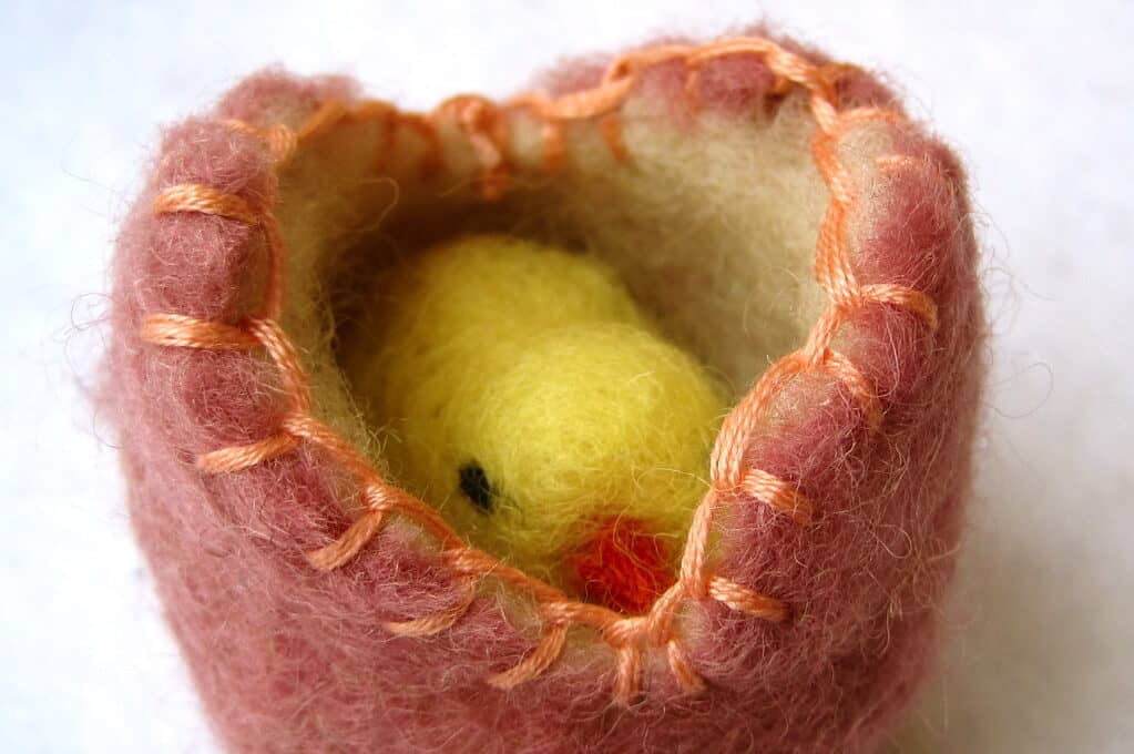 photo of wet felted rose wool cracked egg and baby chick