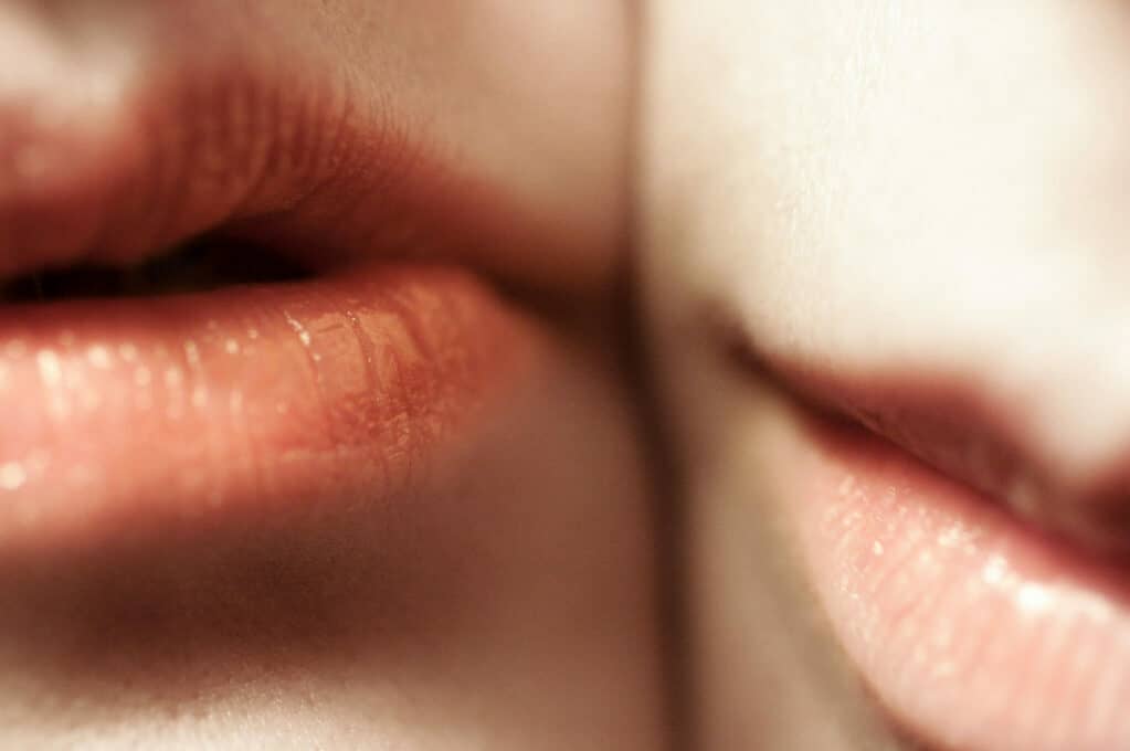 photo of two pairs of lips