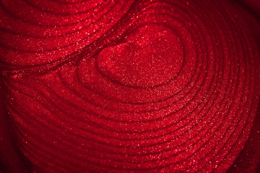 photo of sparkly red nail polish puddle
