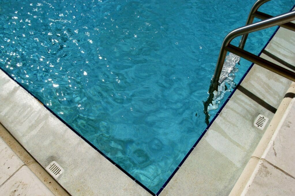 photo of pool with pool ladder