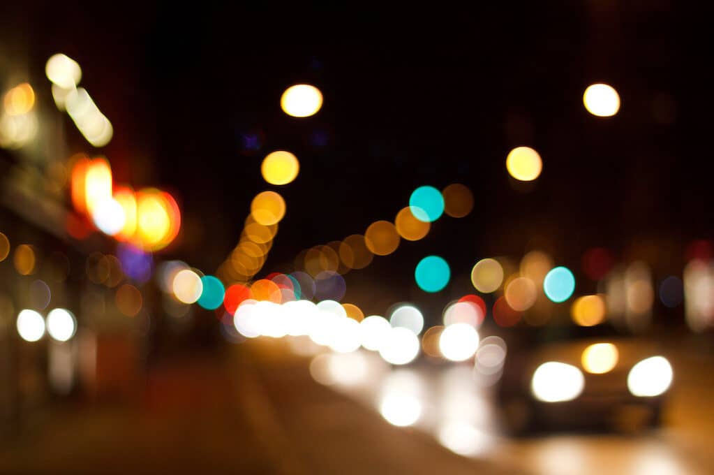 photo of street and traffic lights at night