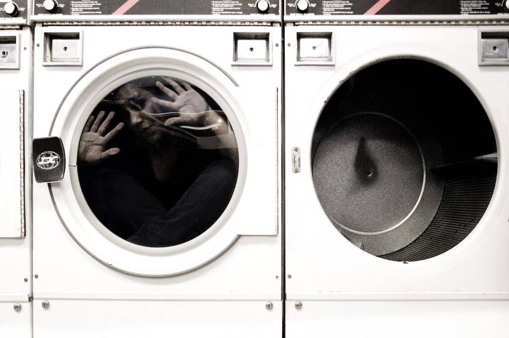 photo of woman trapped in front-loading washing machine