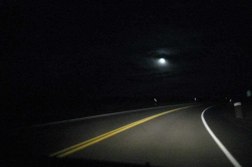 photo of curving road at night