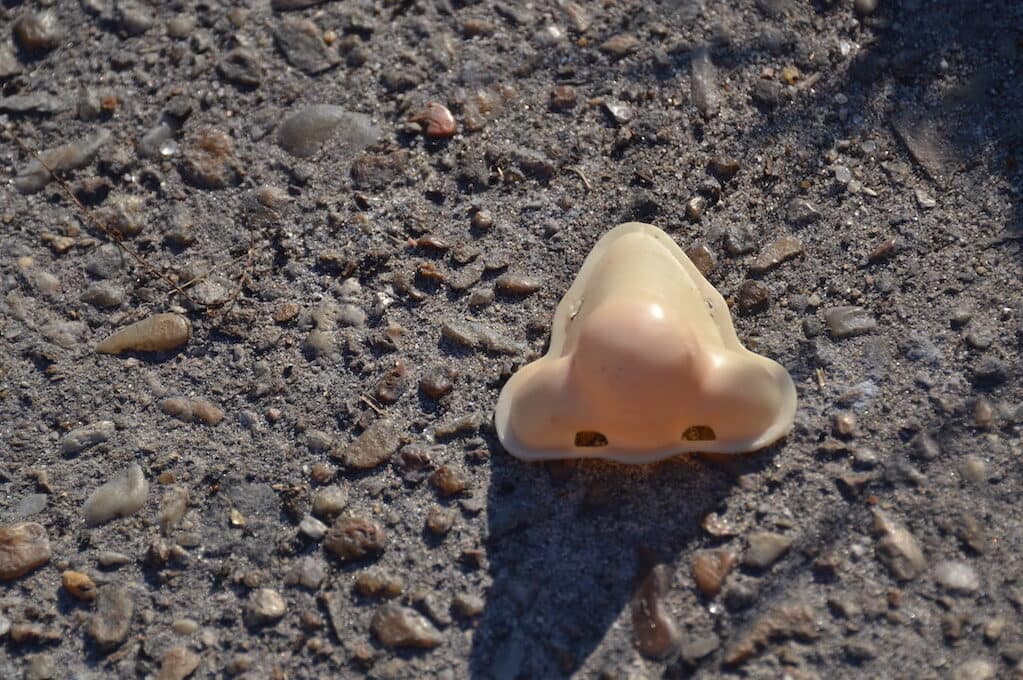 photo of a plastic nose on the ground