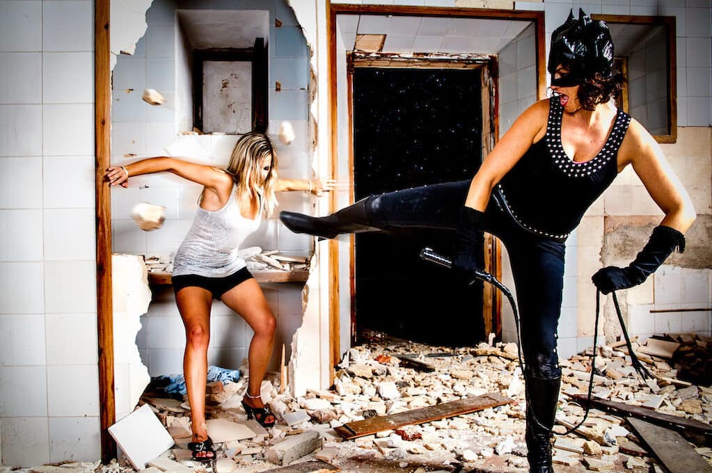 photo of a person dressed up as Catwoman having a fight with another person
