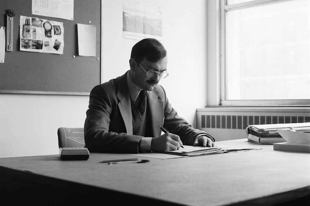 photo of man working at a desk