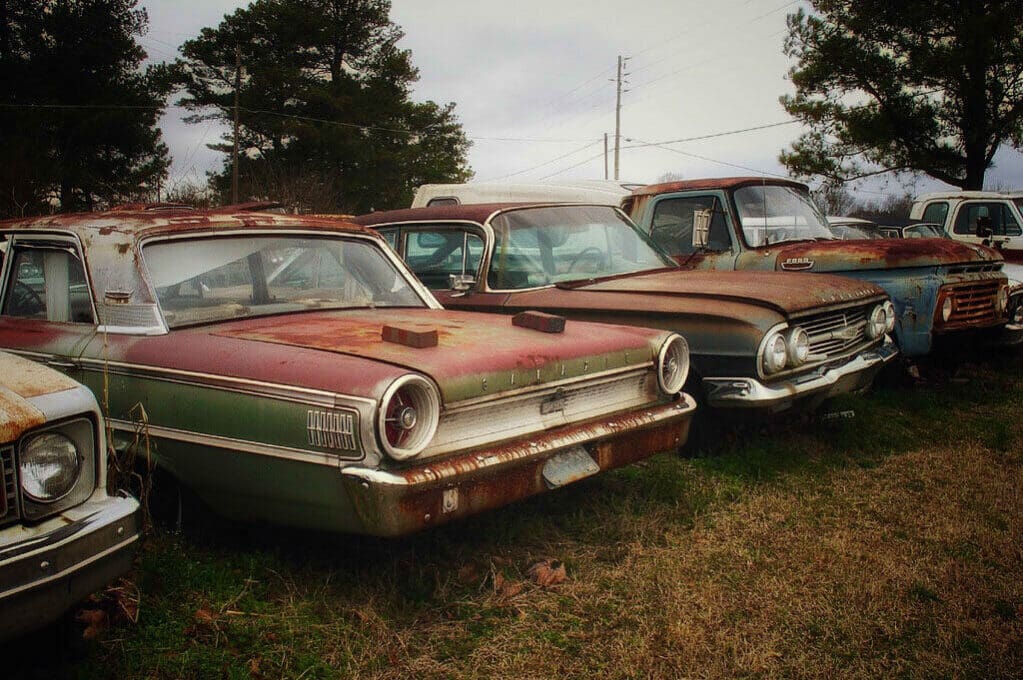 photo of rusting cars