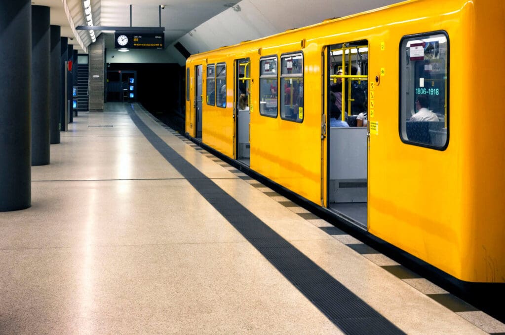 photo of yellow subway car in station