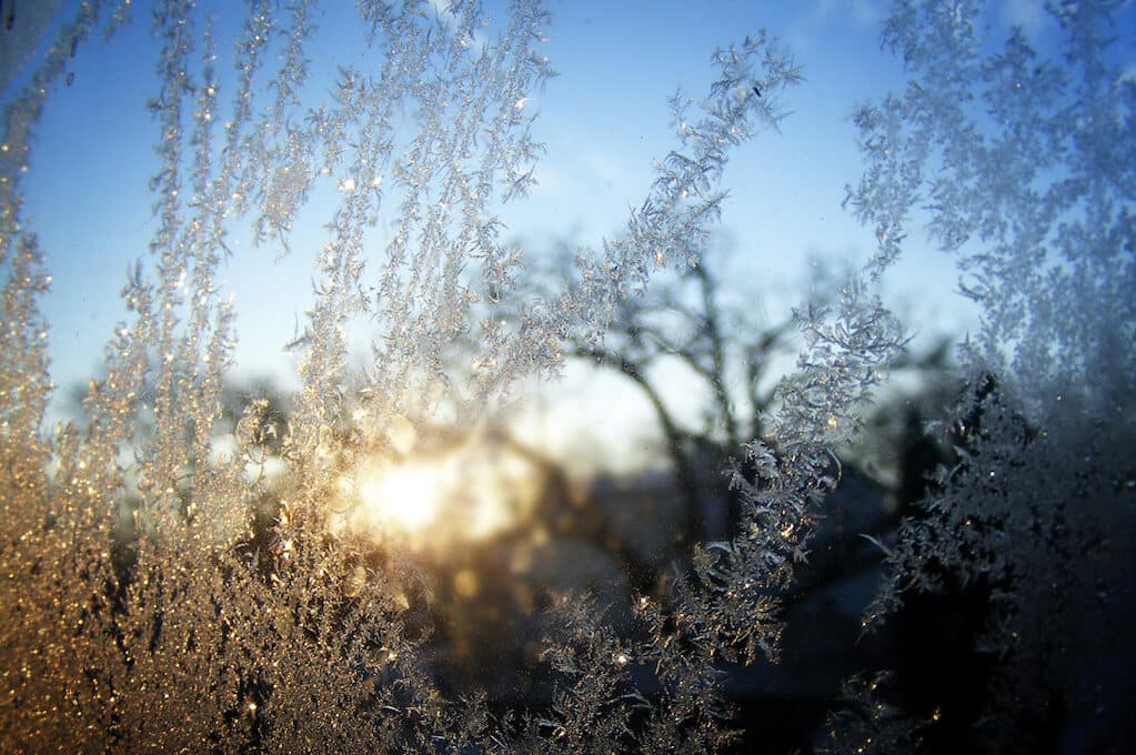 frost on the window at dawn on a cold winter day
