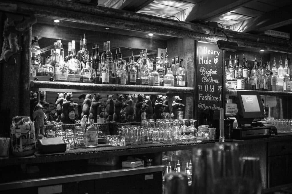 black & white photo of a stocked bar