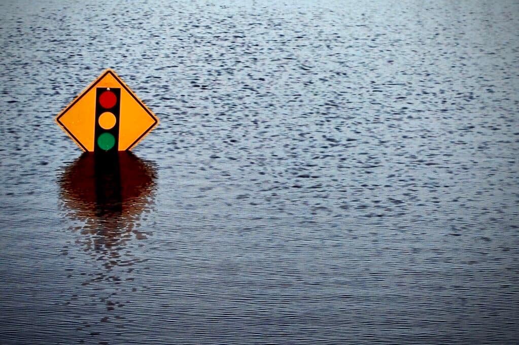 photo of street sign on flooded street