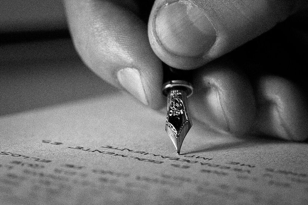 photo of hand writing with fancy pen