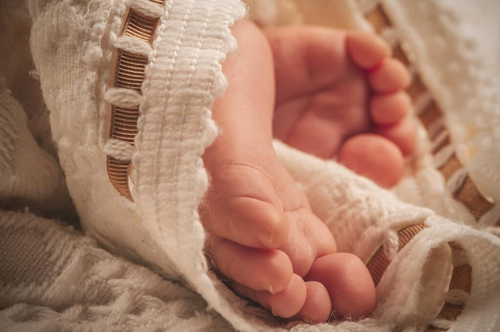 photo of baby feet in blanket