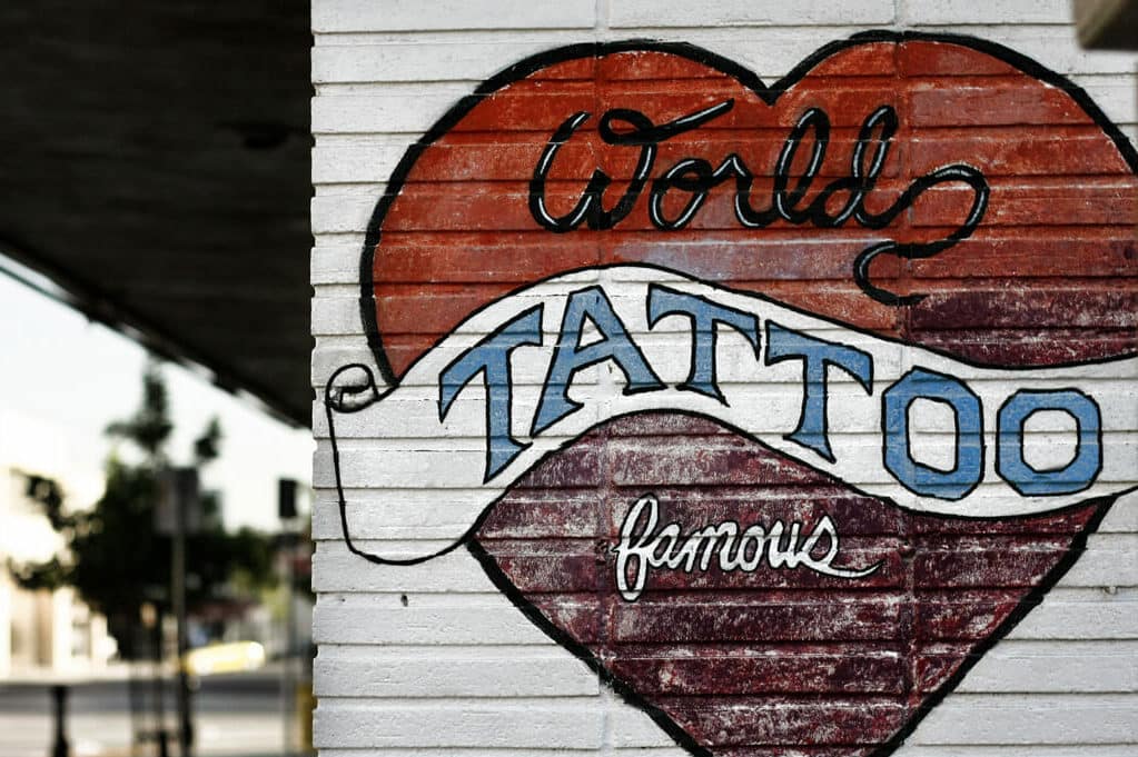 exterior wall of tattoo parlor with depiction of a heart tattoo