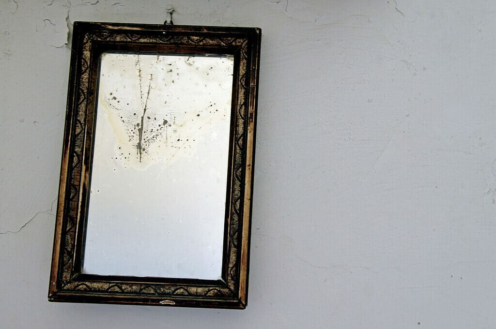 photo of old mirror on wall