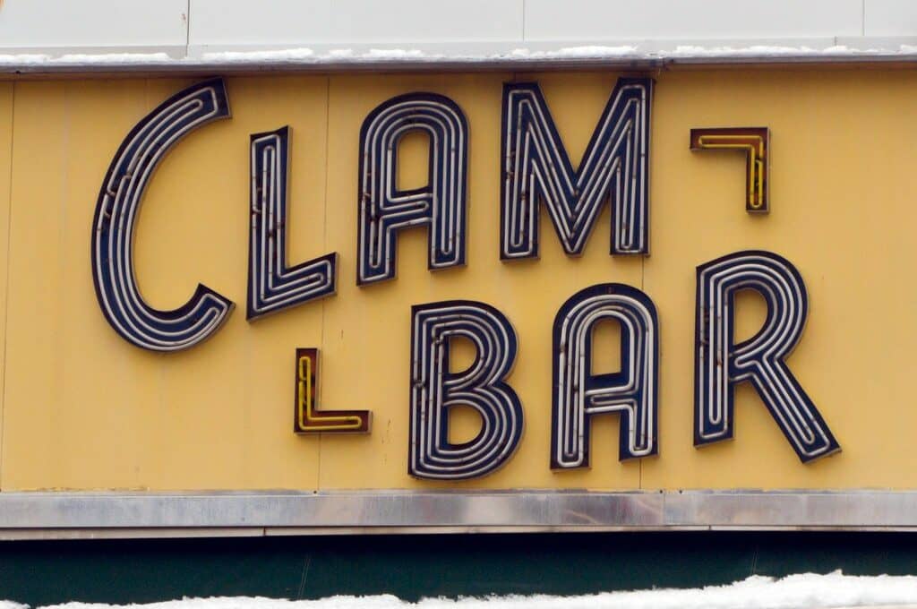 photo of a sign that says "Clam Bar"