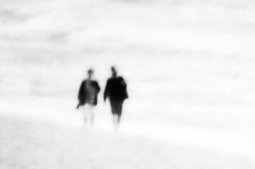 photo of two people walking in the distance