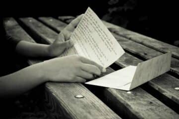 photo of hands holding a love letter