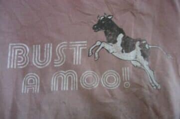 ilustration that says "Bust a Moo!" with leaping cow image
