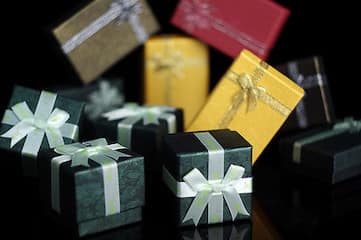 photo of assortment of small gift boxes with bows
