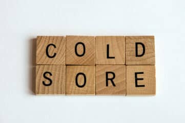 photo of Scrabble letters that spell out "cold sore"